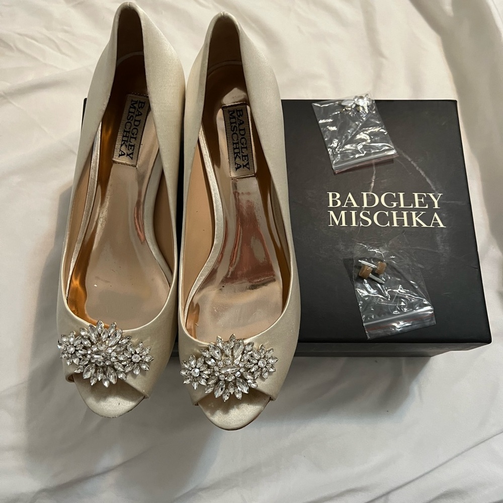 Badgley Mischka open toe 1.5 inch heels. Ivory satin with crystal brooche.